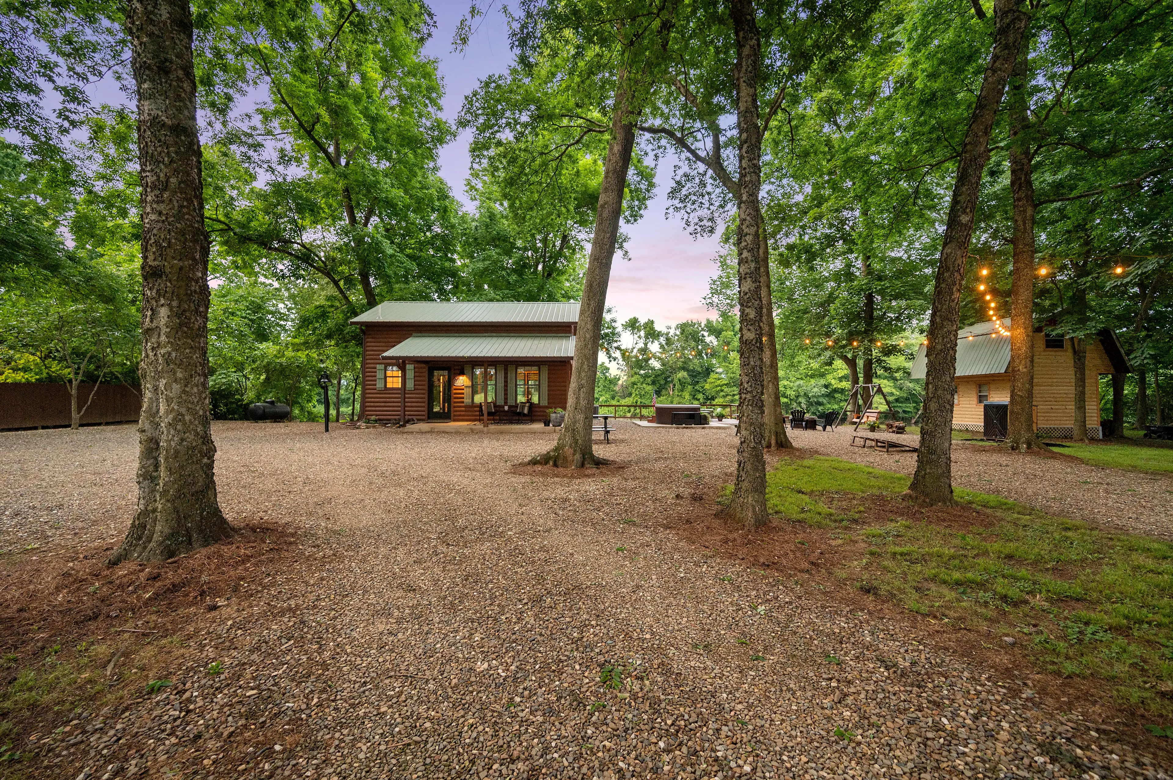 The smaller building is not another cabin. It is a storage shed.