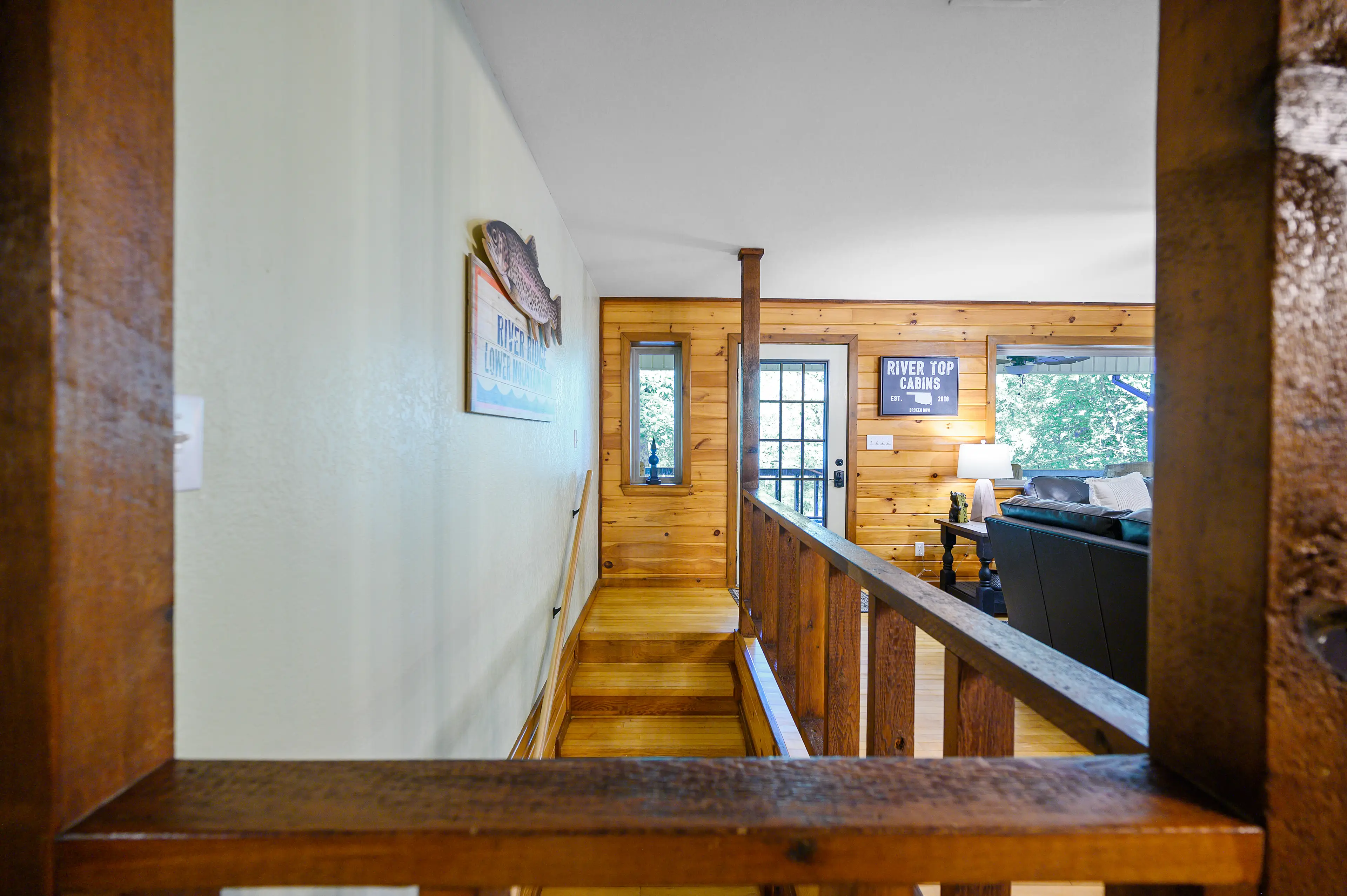 The stairs will take you to the downstairs king ensuite, game room, and lower level back porch.