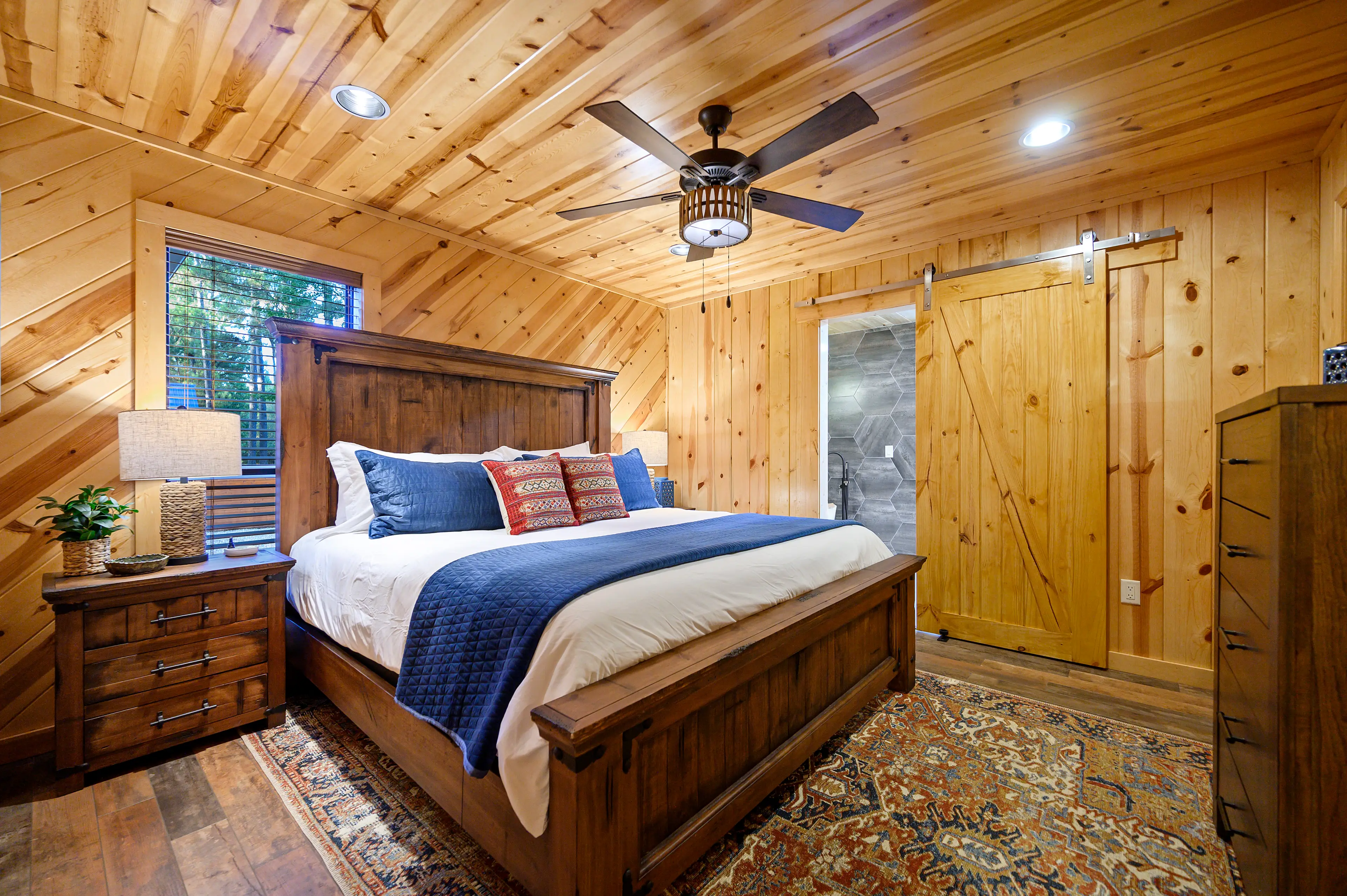 The ensuite attaches to the second king with custom barn doors.