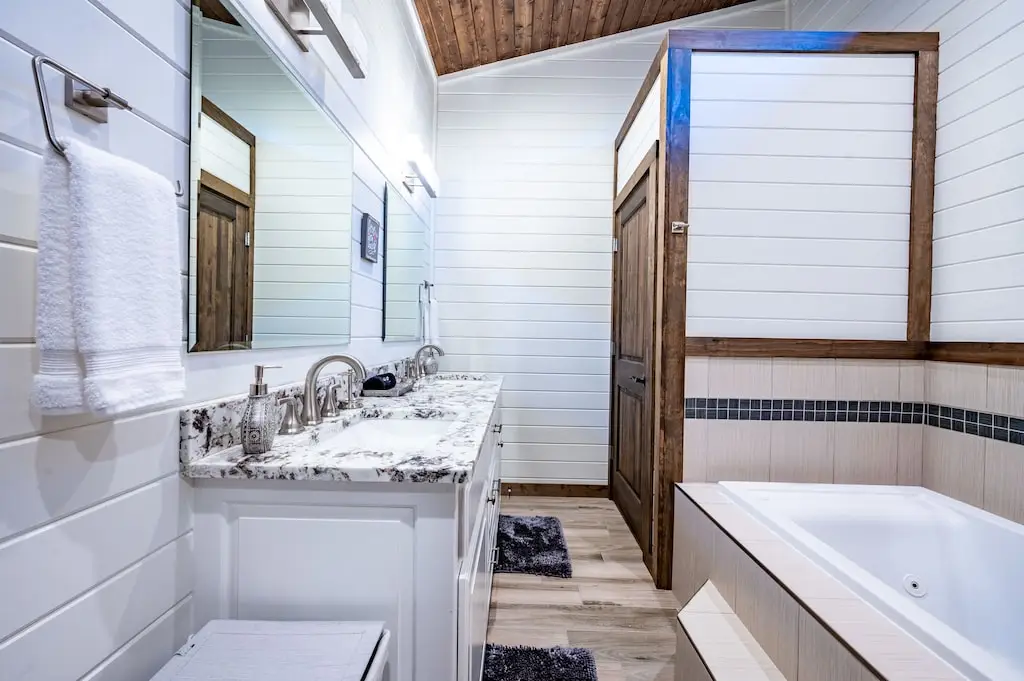 jacuzzi tub with separate walk-in shower in master bath