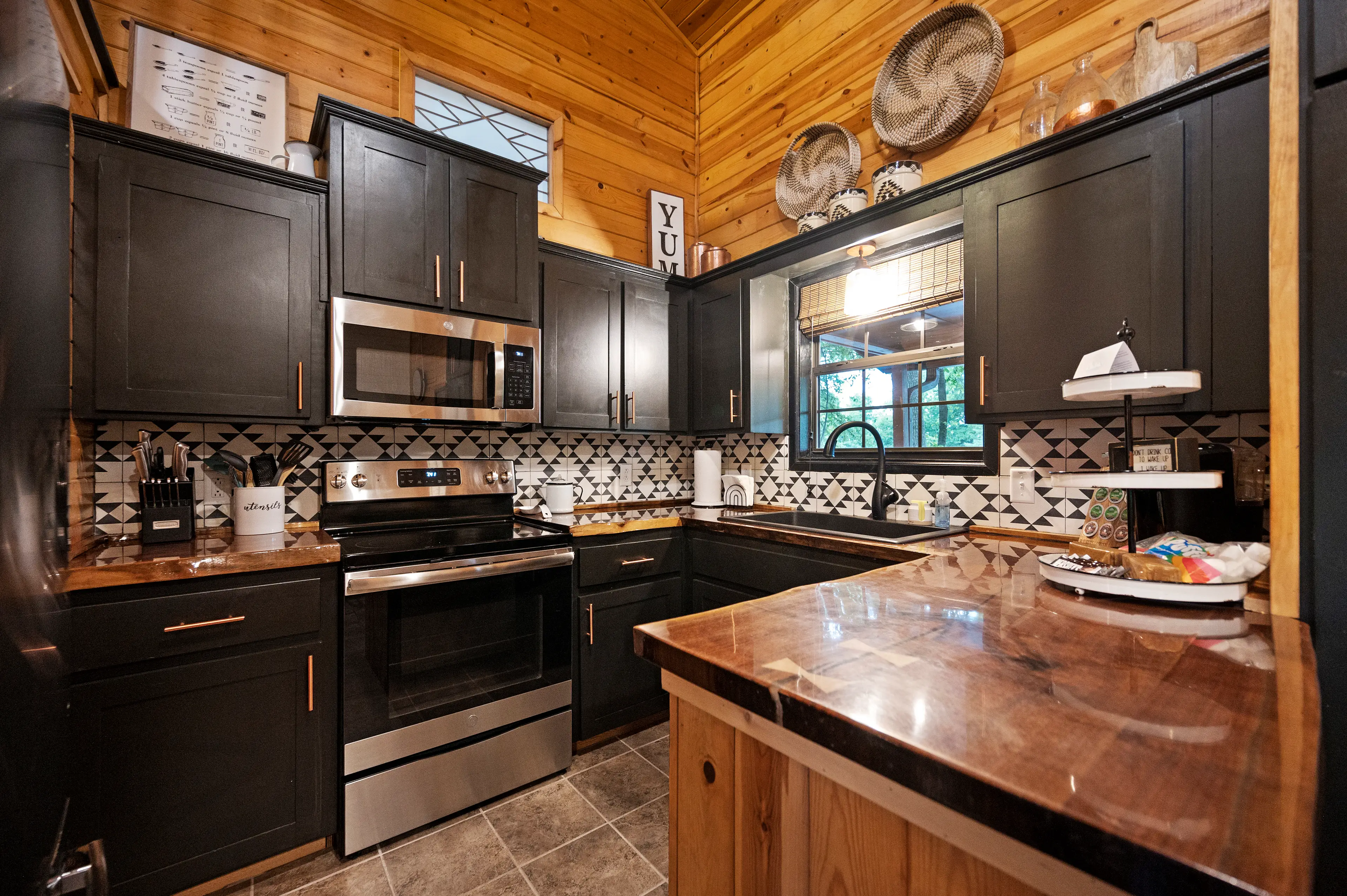 The kitchen is small, but fully stocked with full sized appliances!