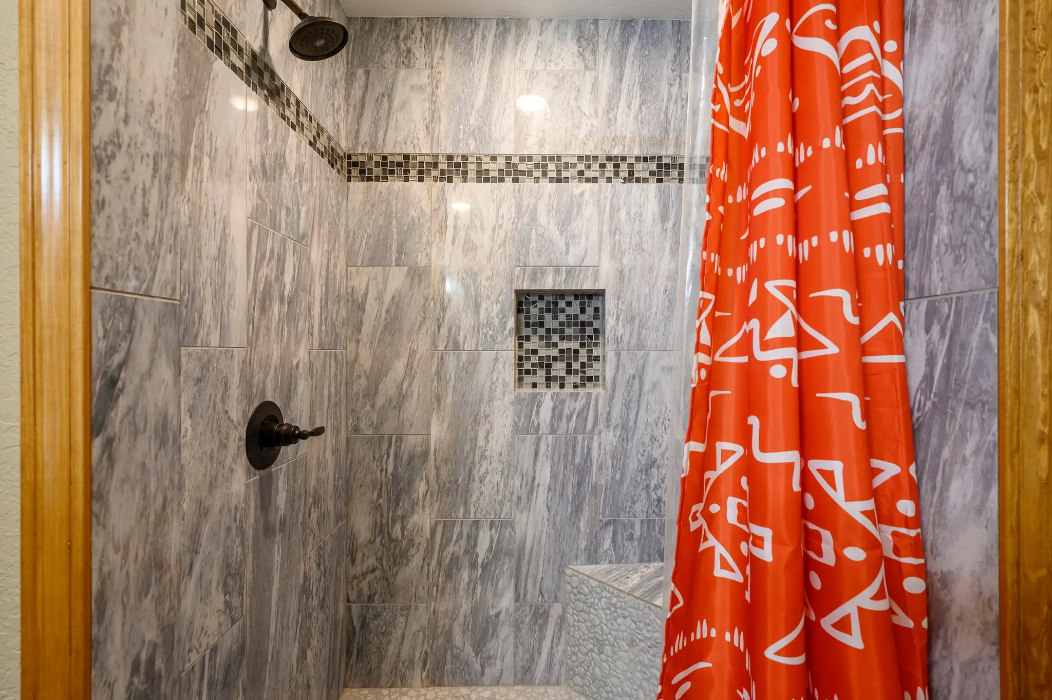The bathroom has a nice sized shower, not a tub.