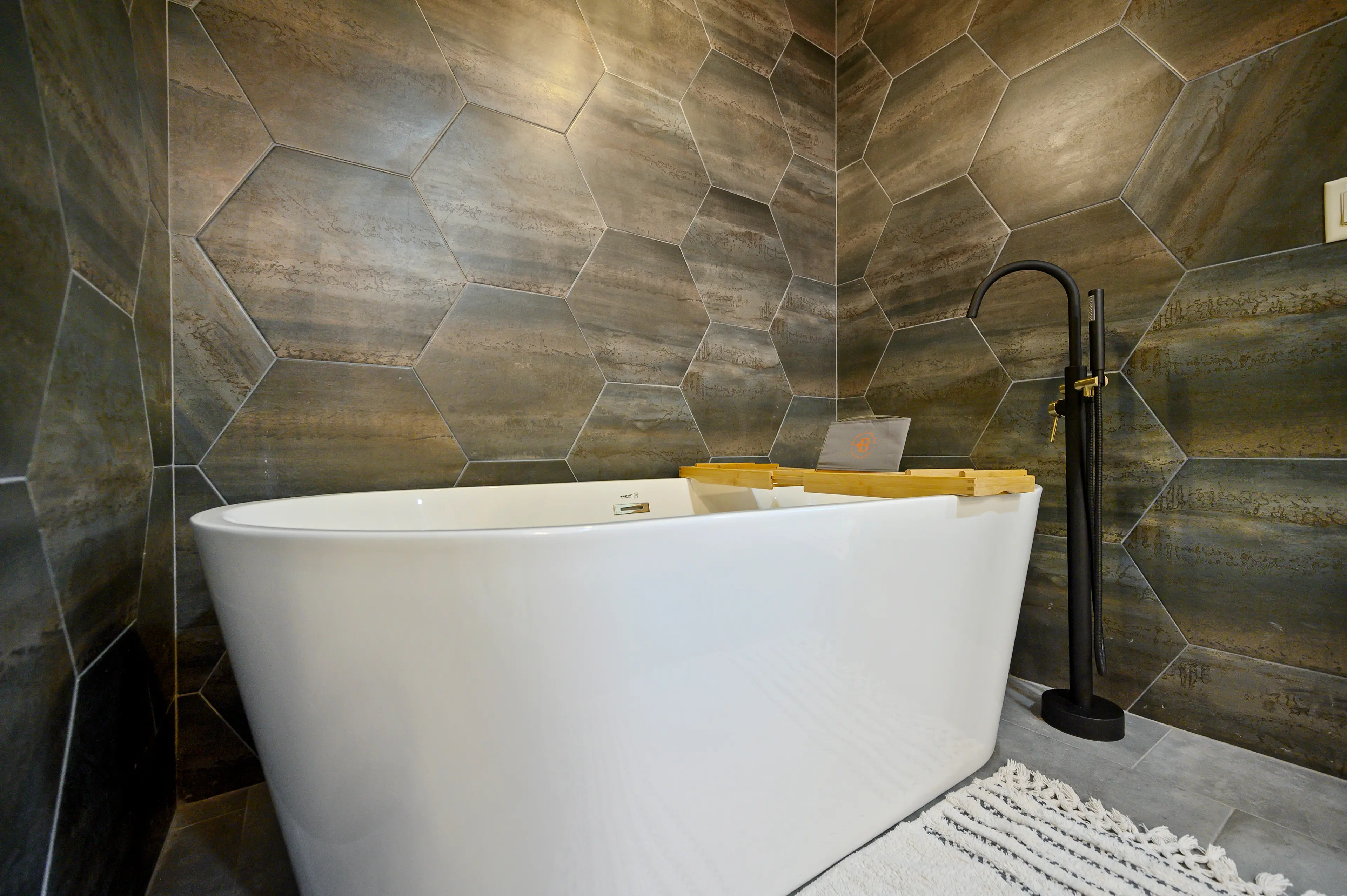 Enjoy a glass of wine or read a book while soaking in this spacious tub!