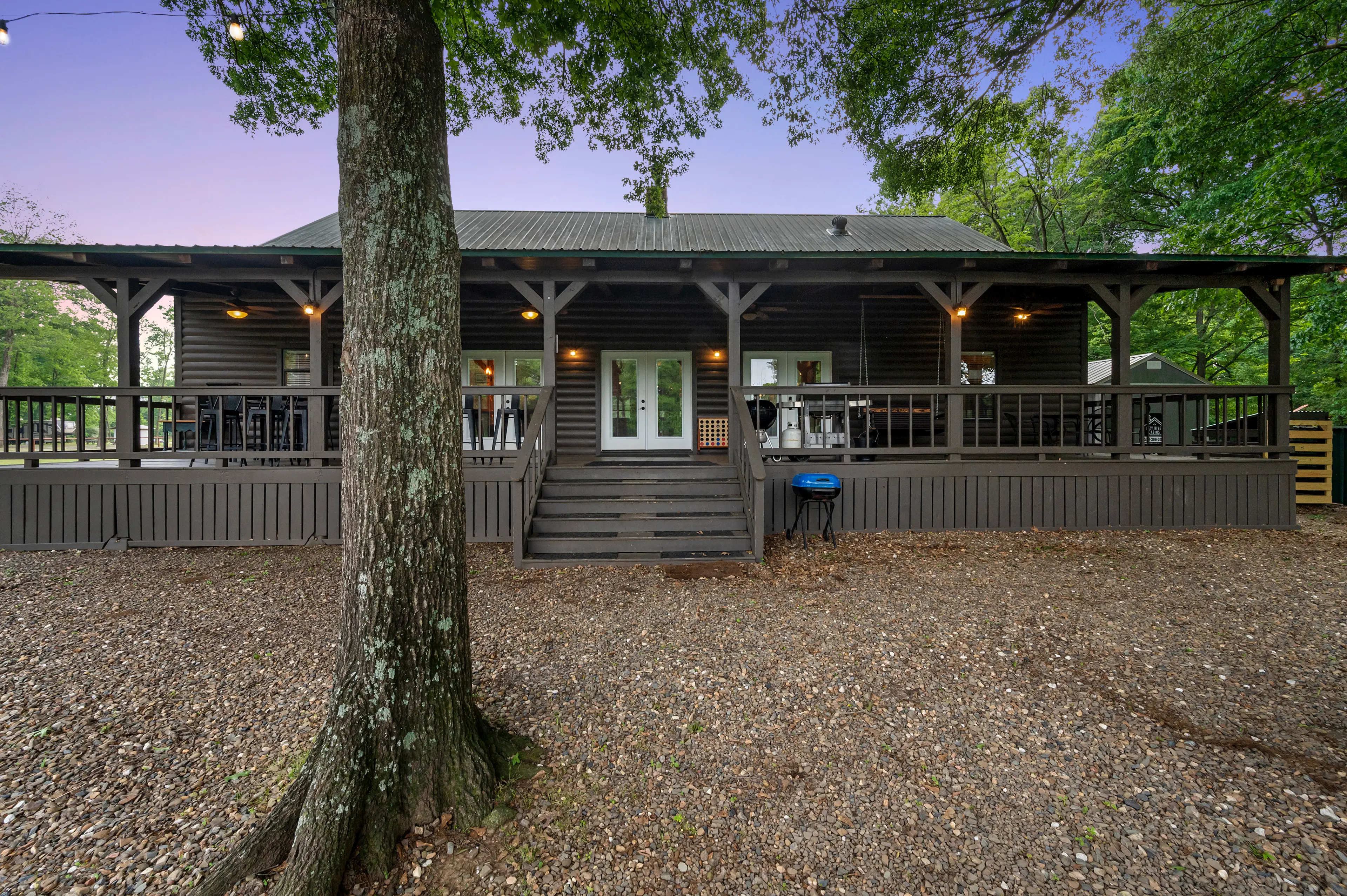 Charcoal and propane grills on the back porch.