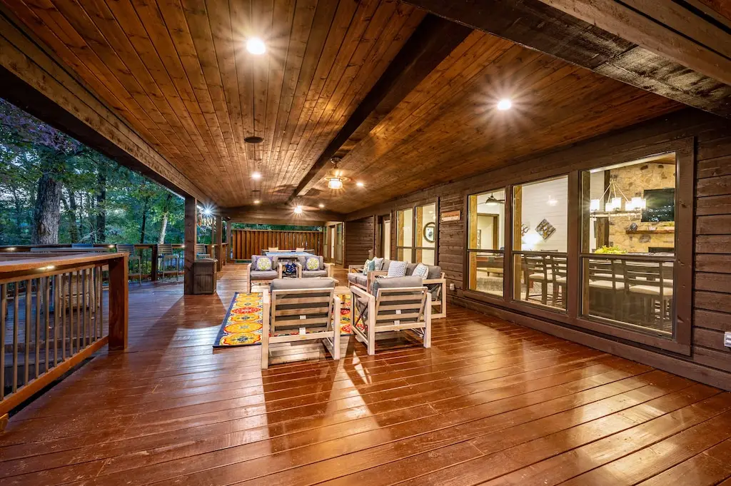 The huge patio runs the length of the cabin and has several seating areas.