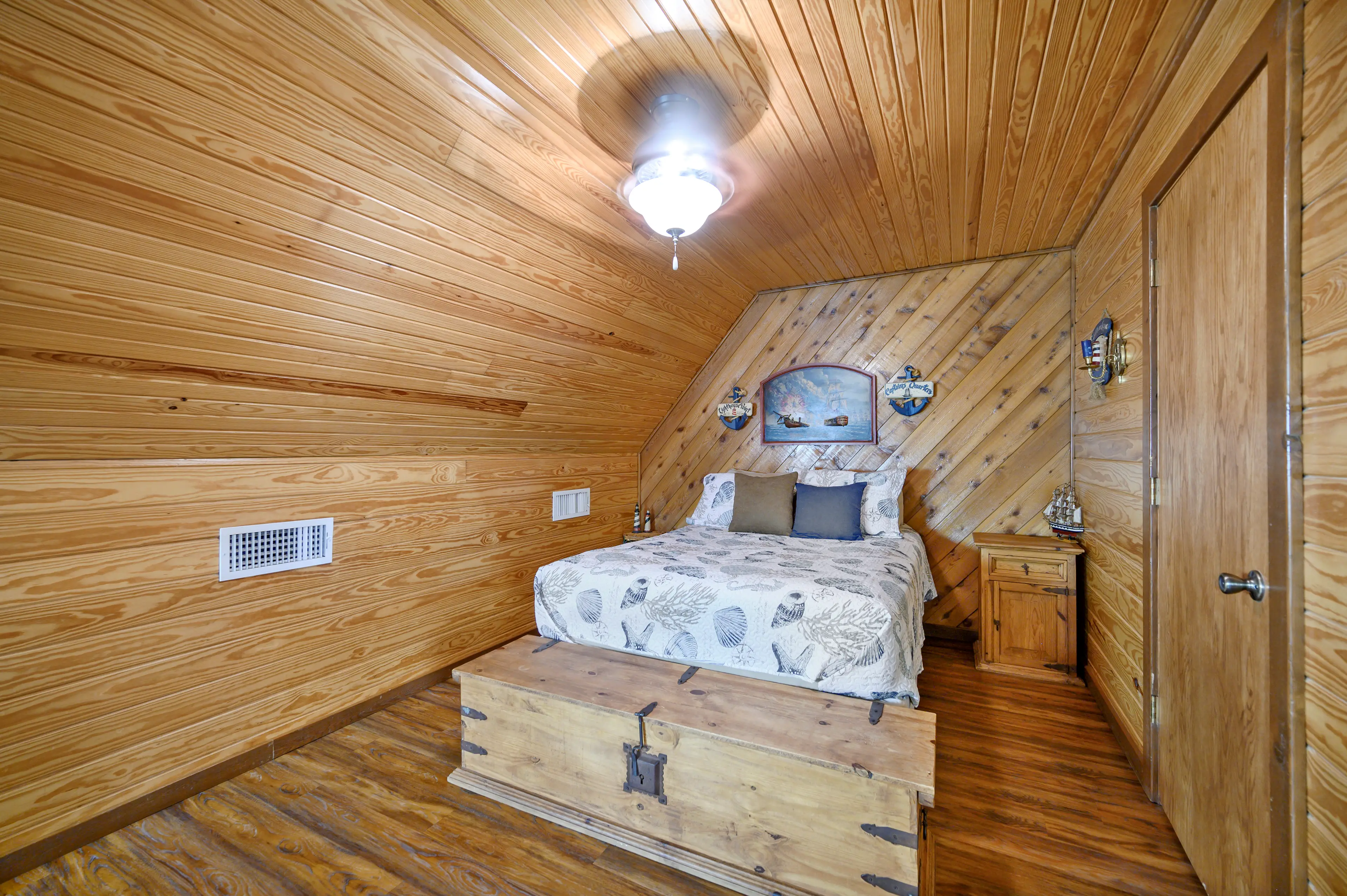 The queen upstairs bed in the open sleeping loft.
