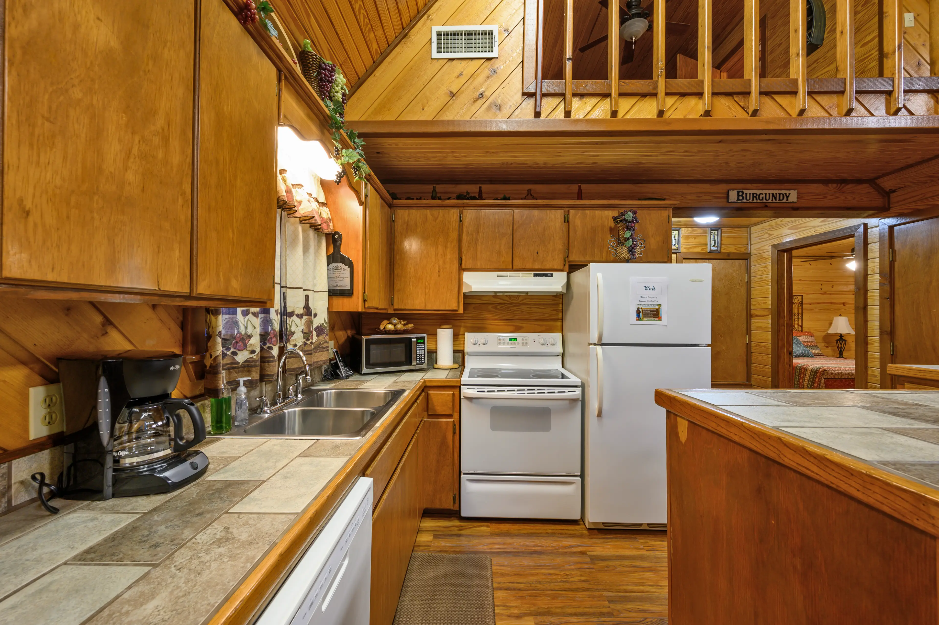 The kitchen has full size appliances, including a dishwasher.