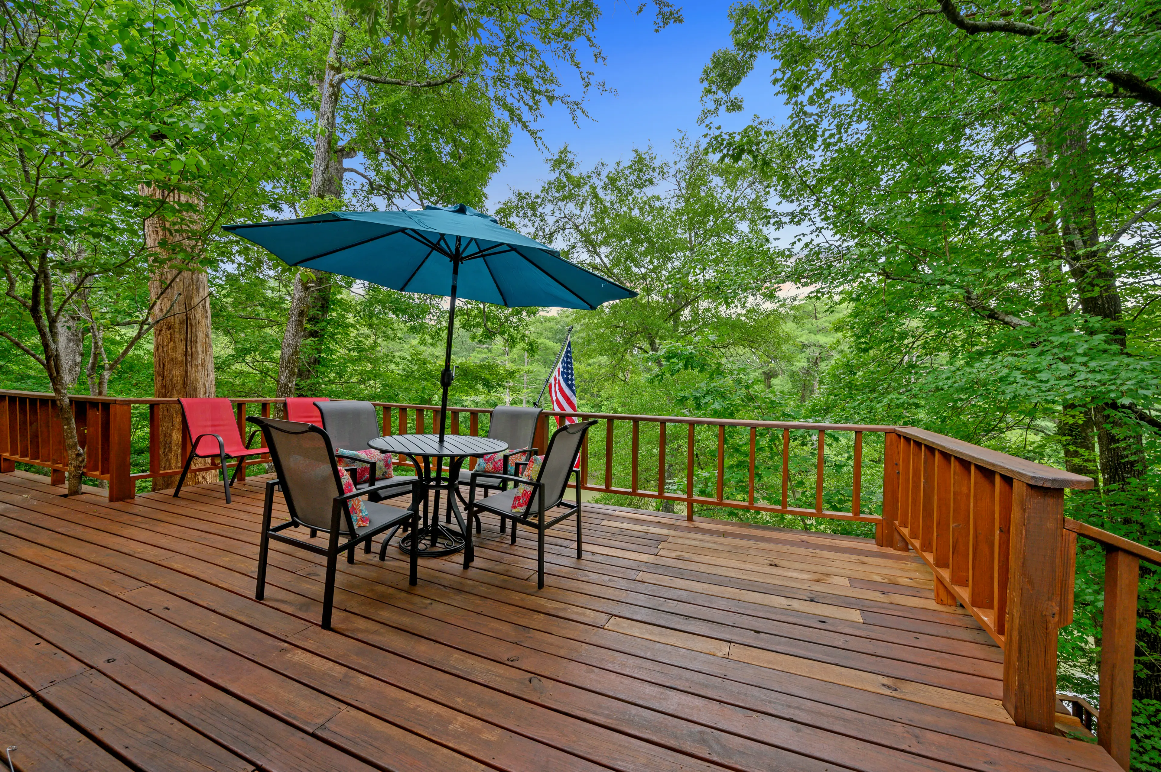 While the porch isn't covered, the umbrella provides shade.