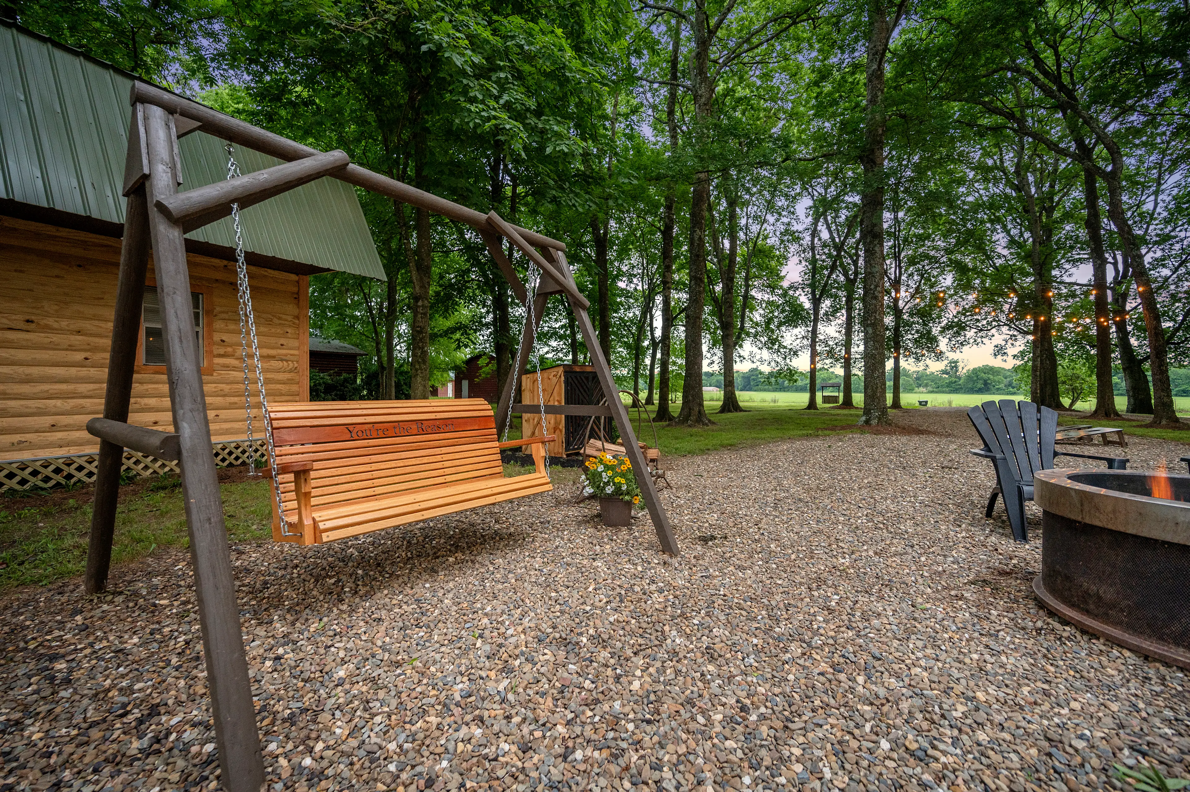 Porch swing to either enjoy the firepit or the river views.