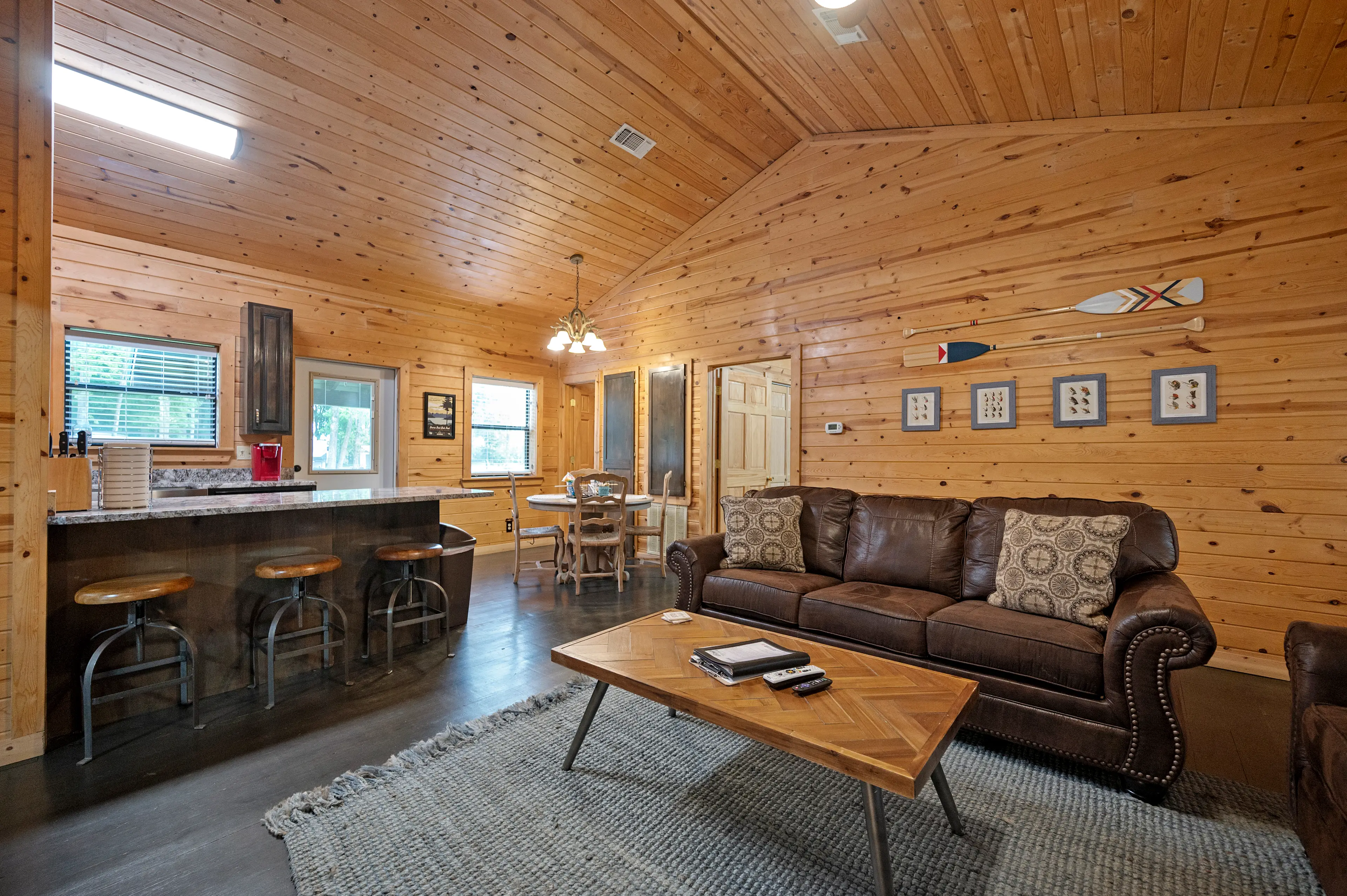 The living room opens to the dining area and kitchen with bar seating.