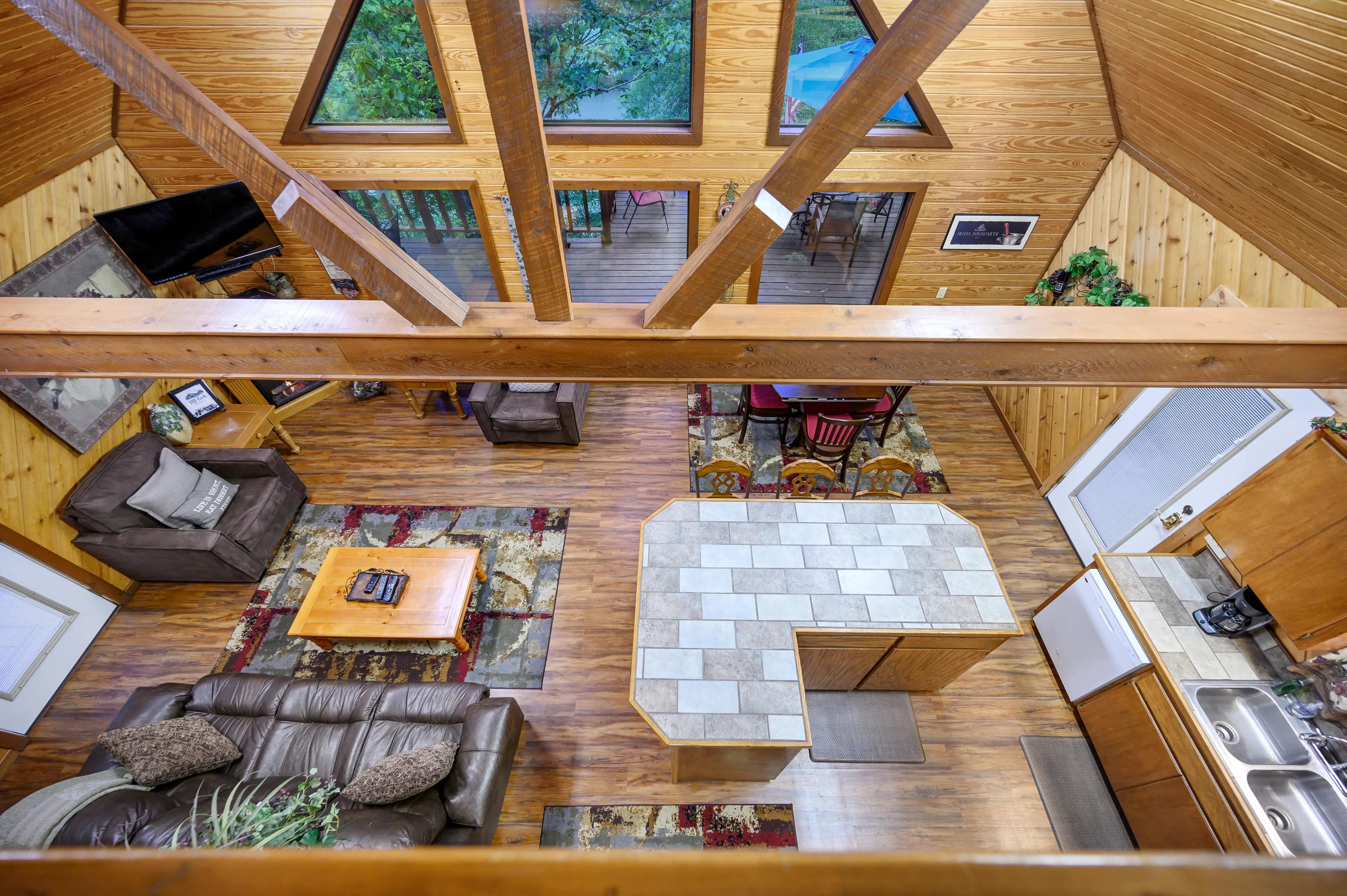 Looking over the upstairs railing into the living area below.