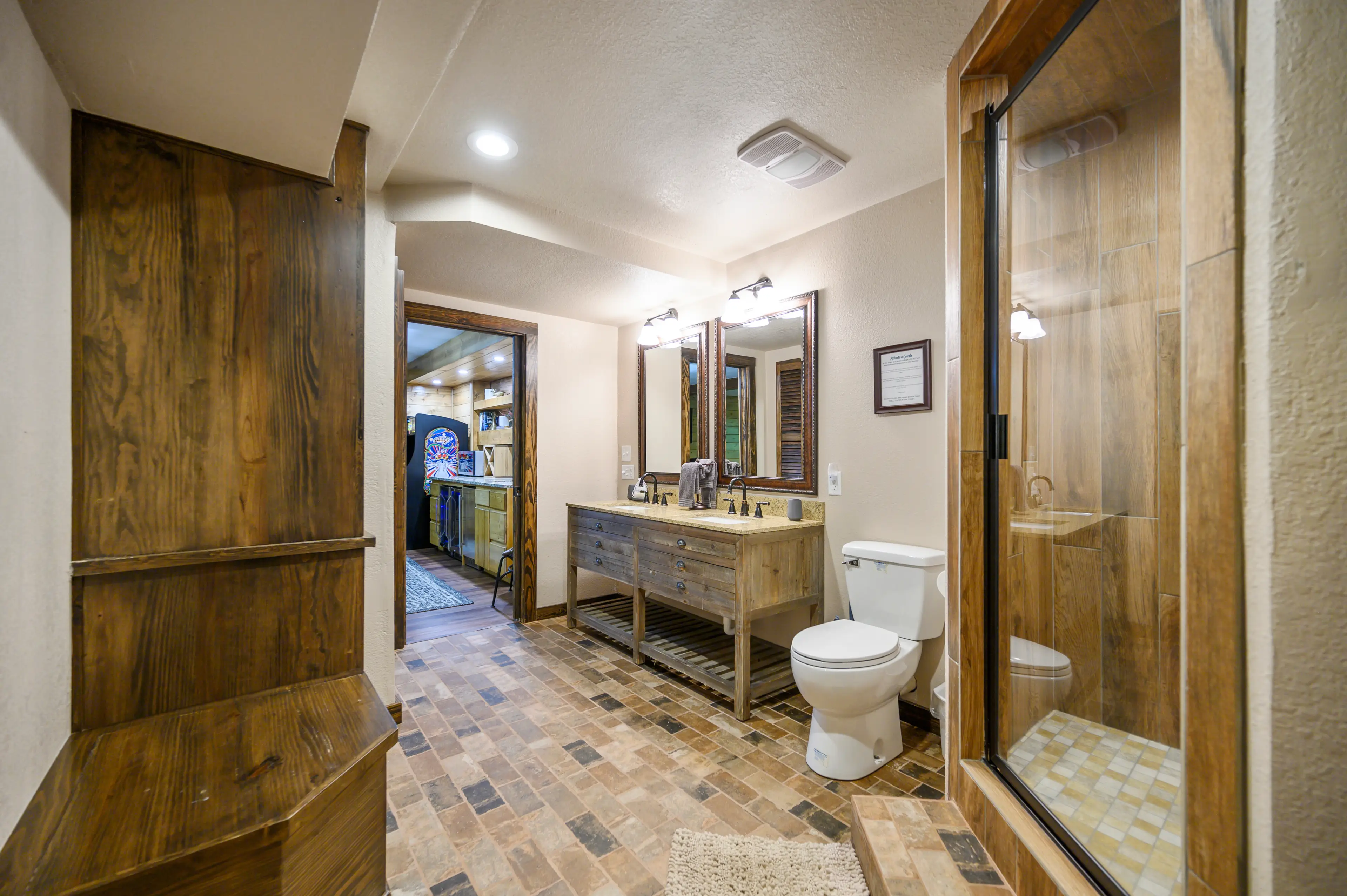 The downstairs bath has a double vanity and walk in shower.