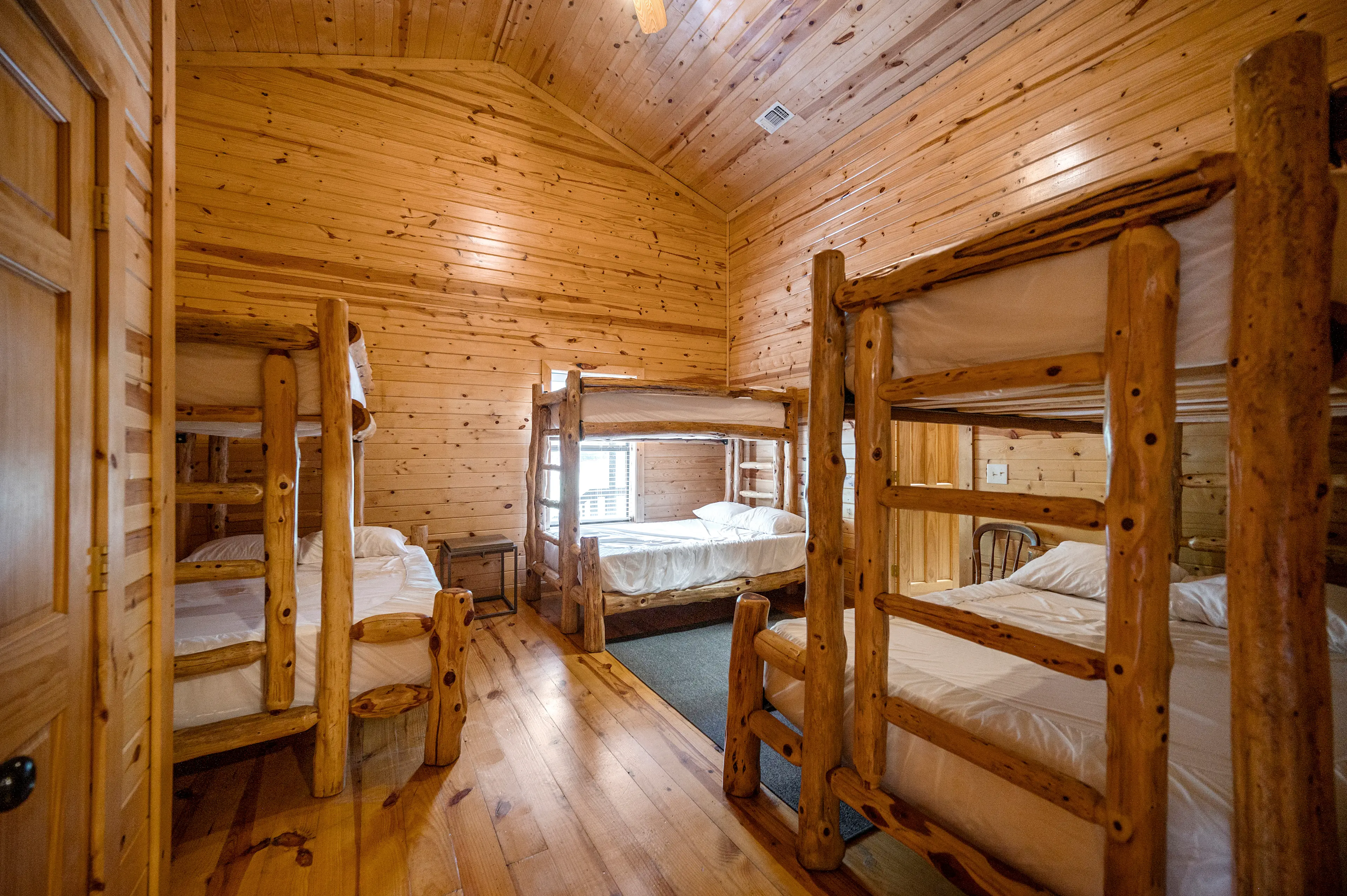 Bunk room one has 3 sets of twin over full bunk beds.