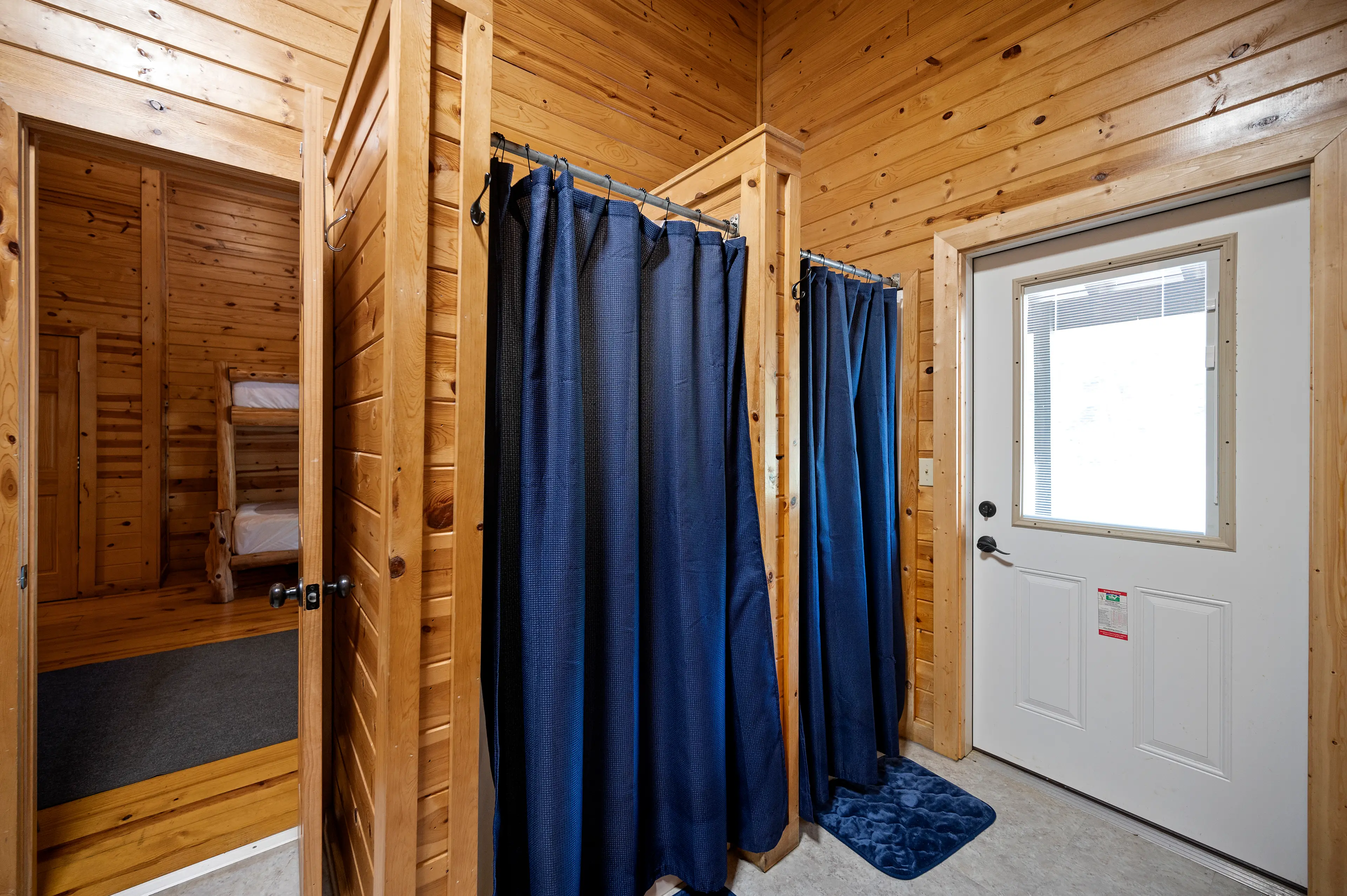 Each bath also has two shower stalls and two water closets.