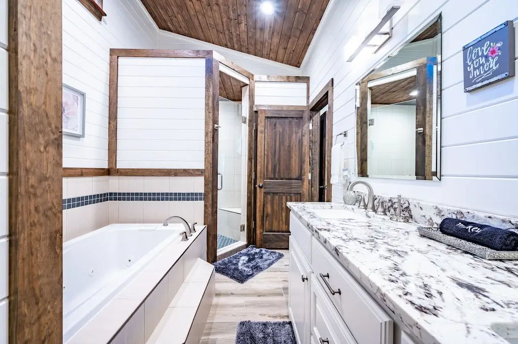 Jacuzzi tub and walk-in shower in king master suite