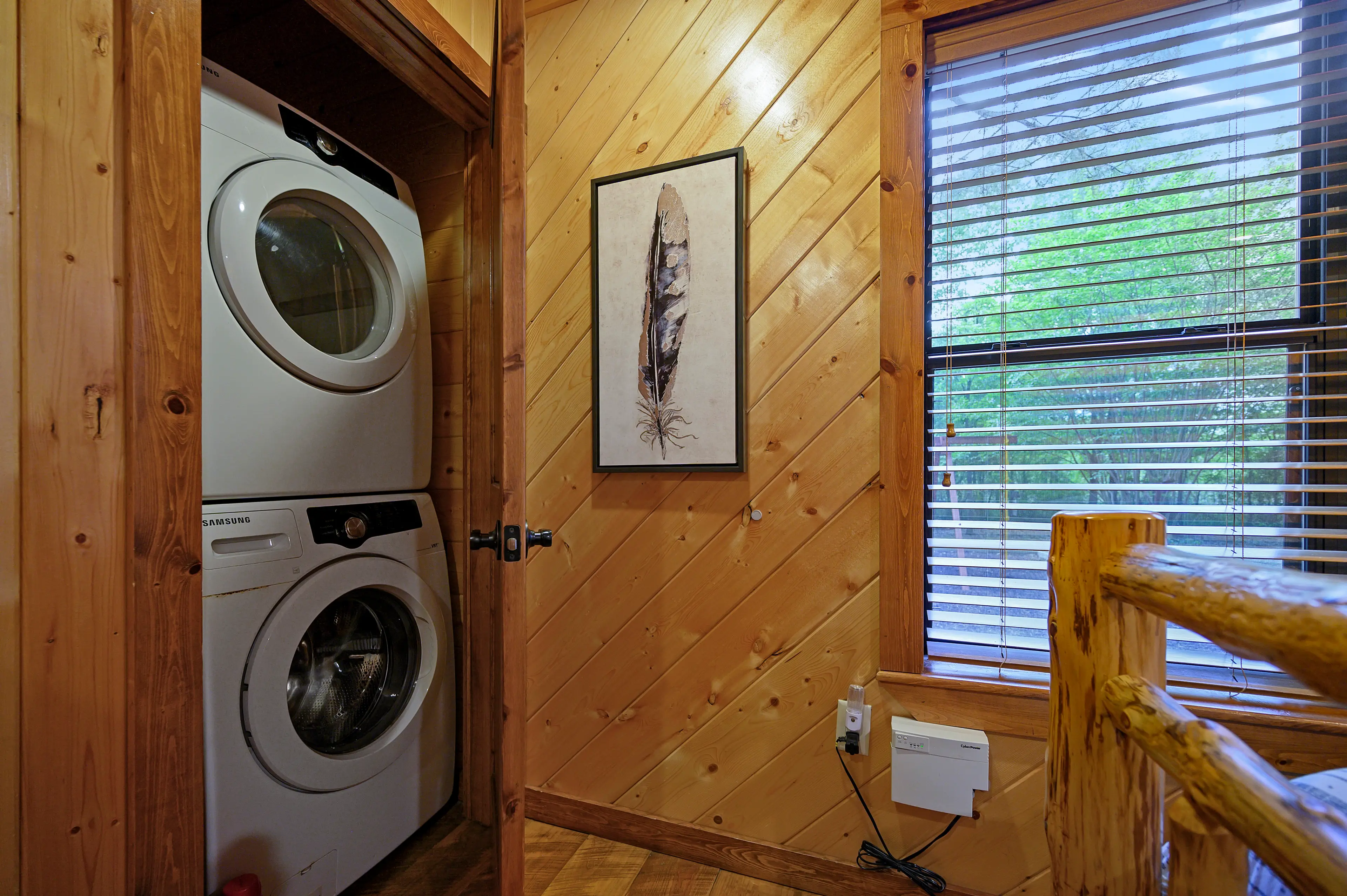 The stackable washer and dryer is located in a closet in bedroom two.