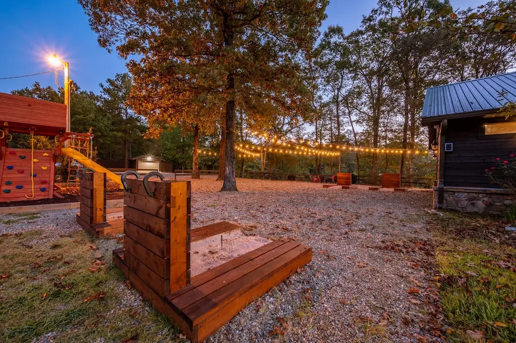 Horseshoe pits, fire pit with seating, and a play set for the kiddos.