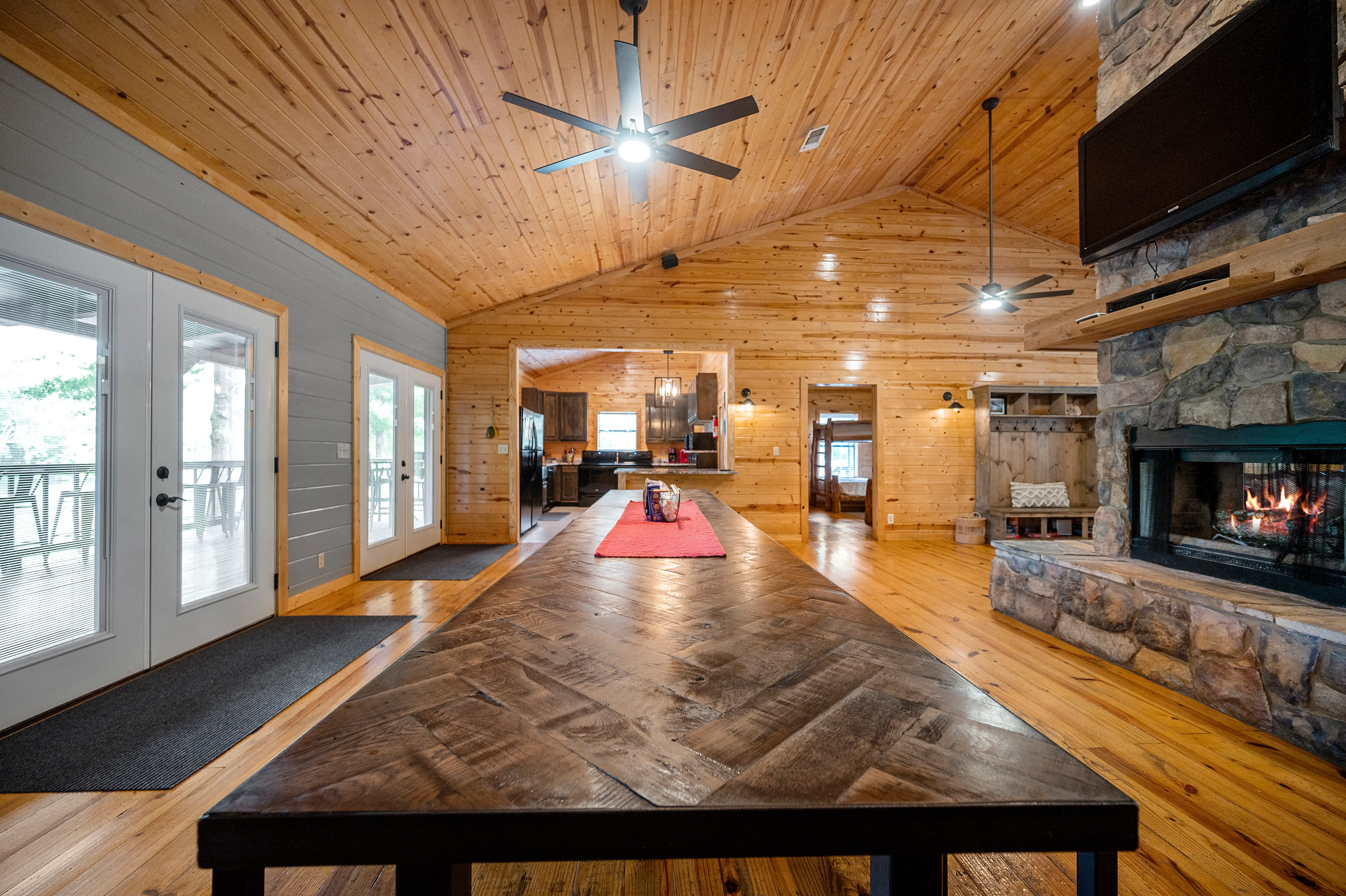 Dining table with 3 sets of French doors to enjoy the view!