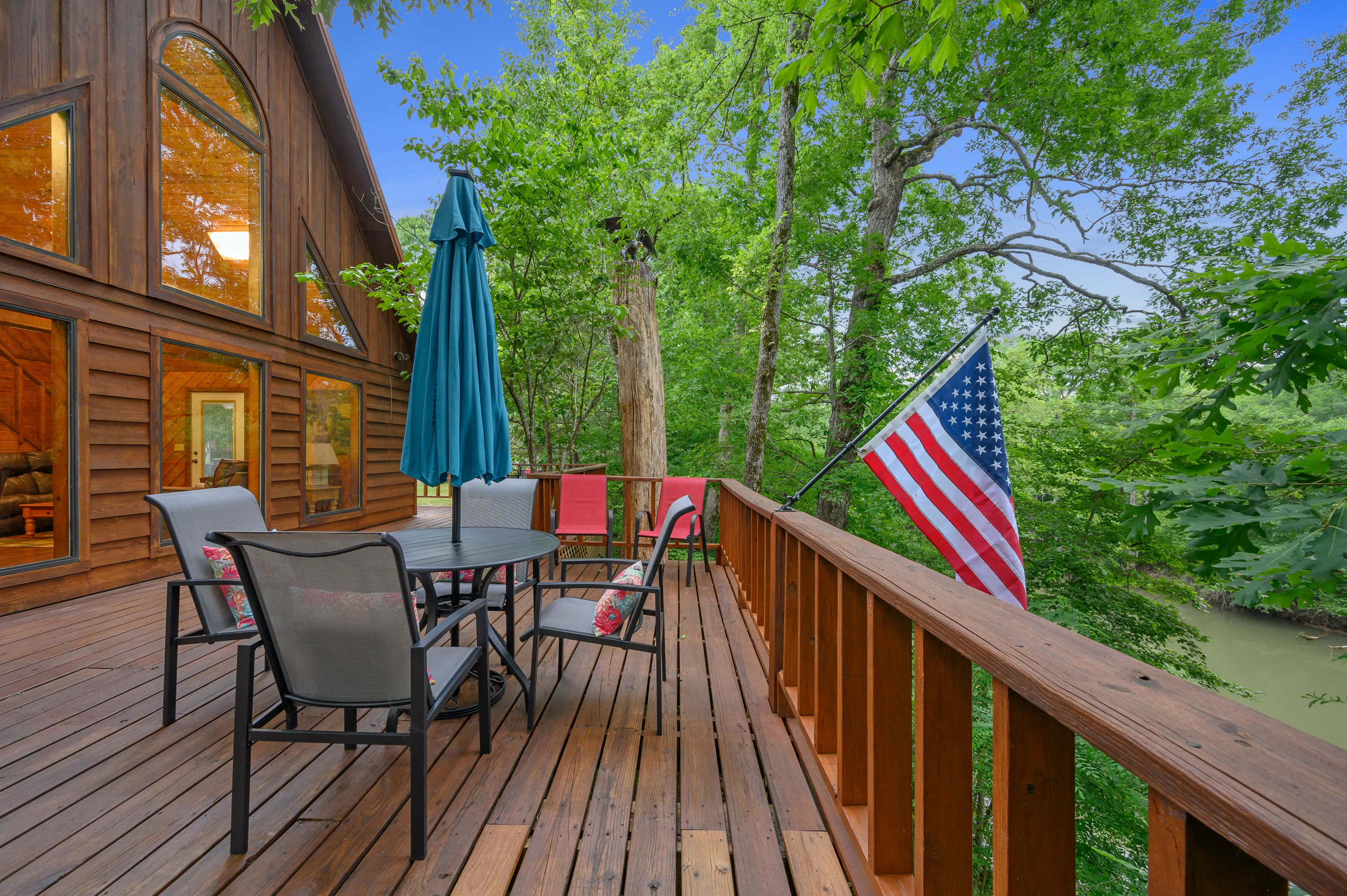 Enjoy dining outside on the large porch with views of the lower Mt Fork River.